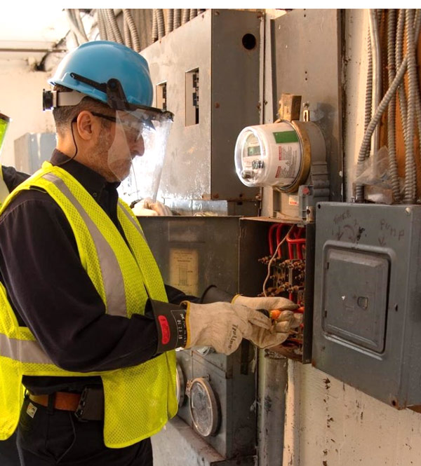 worker-examining-electrical-panel