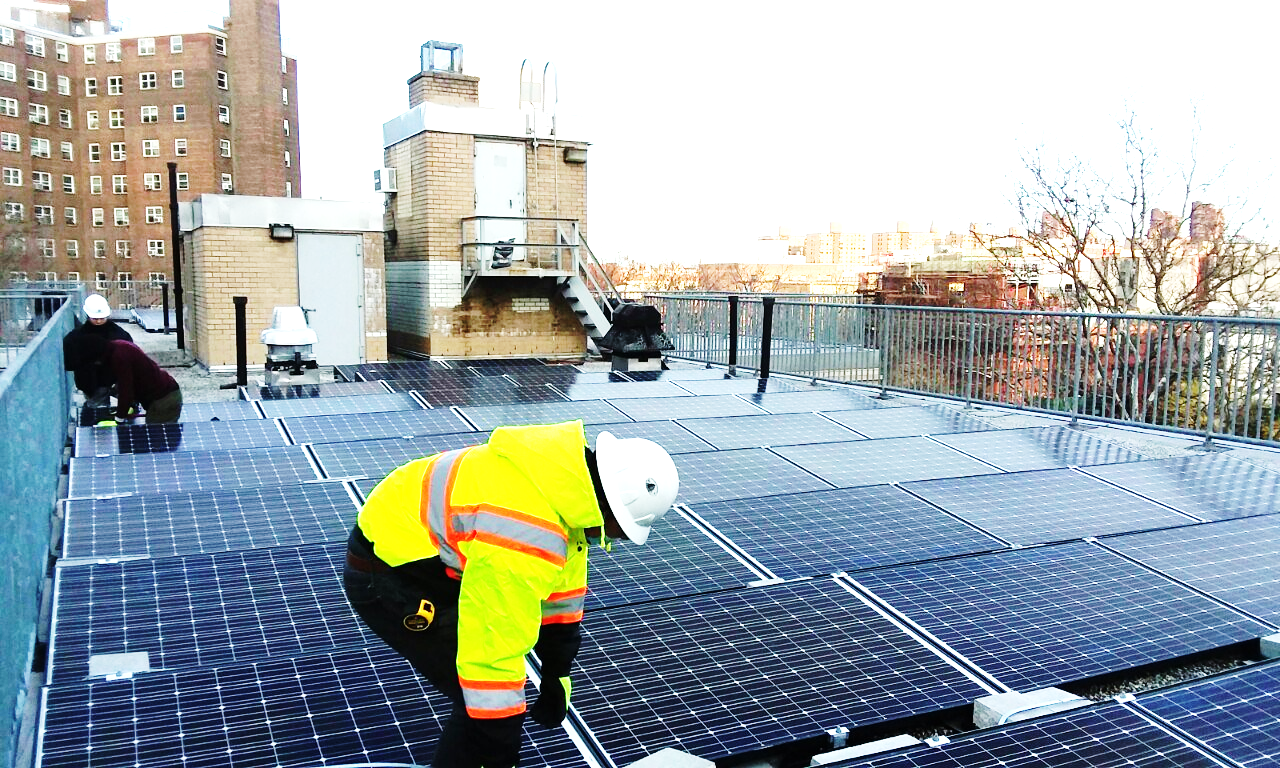 coned workers install solar panels