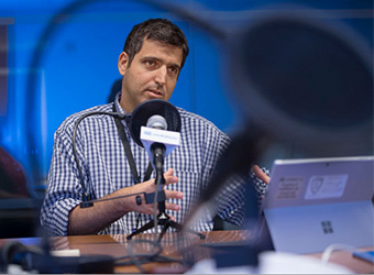 A man speaking into a microphone.