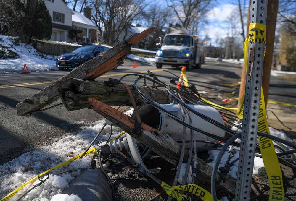 A transformer fallen in a snow covered street, part of the Winter Storm damage Con Edison is working to repair