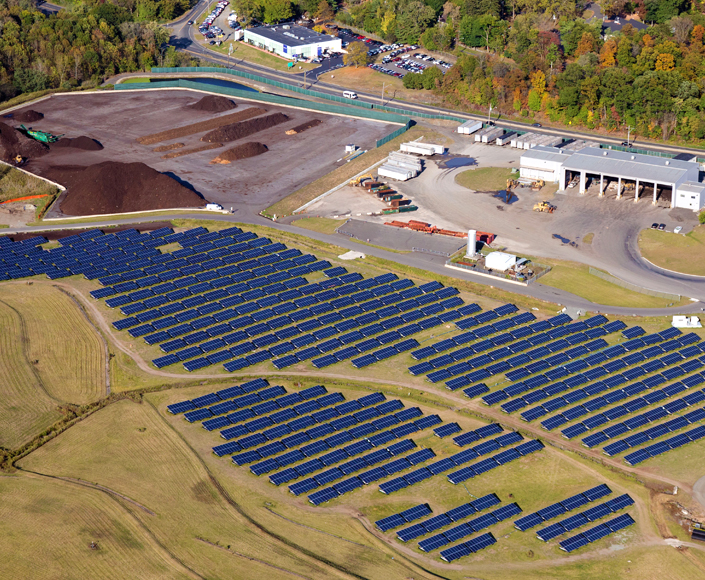 An overhead view of solar panels in a field.