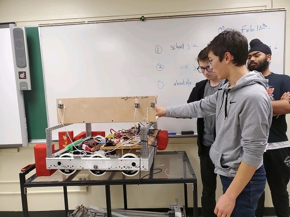Students working on a science project in a classroom.